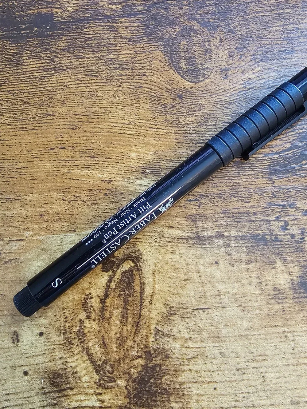 Faber-Castell Pitt Artist Pen with black India ink and a Superfine (S) tip
